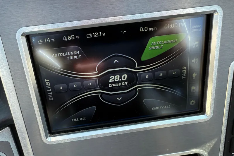 Slide: The Image of 2019 MasterCraft XT22 dashboard display showing ballast and autolaunch settings. - 17