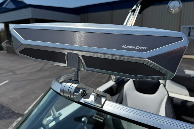 Slide: The Image of 2019 MasterCraft XT22 rearview mirror, sleek design, mounted on boat windshield. - 18