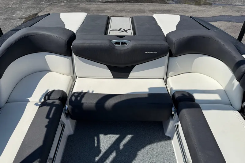 Slide: The Image of 2019 MasterCraft XT22 boat interior with black and white seating. - 21