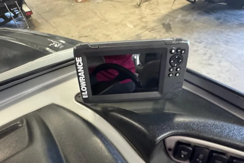 Slide: The Image of 2019 Tracker Targa V-18 WT boat interior with trolling motor and carpeted deck. - 10