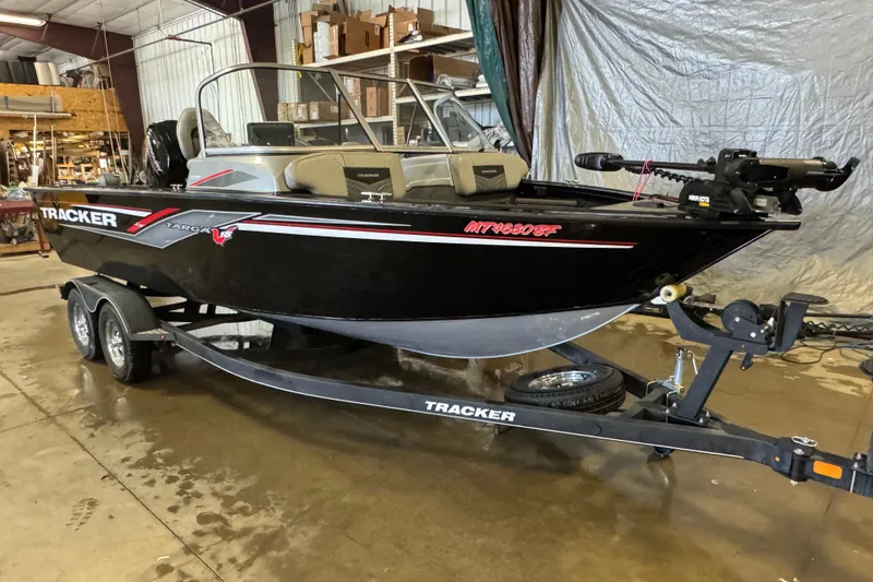 Slide: The Image of 2019 Tracker Targa V-18 WT boat on trailer in a garage setting. - 2