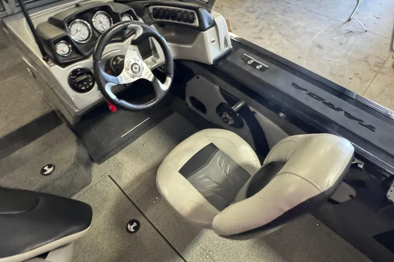 Slide: The Image of 2019 Tracker Targa V-18 WT boat dashboard with steering wheel and Lowrance display. - 8