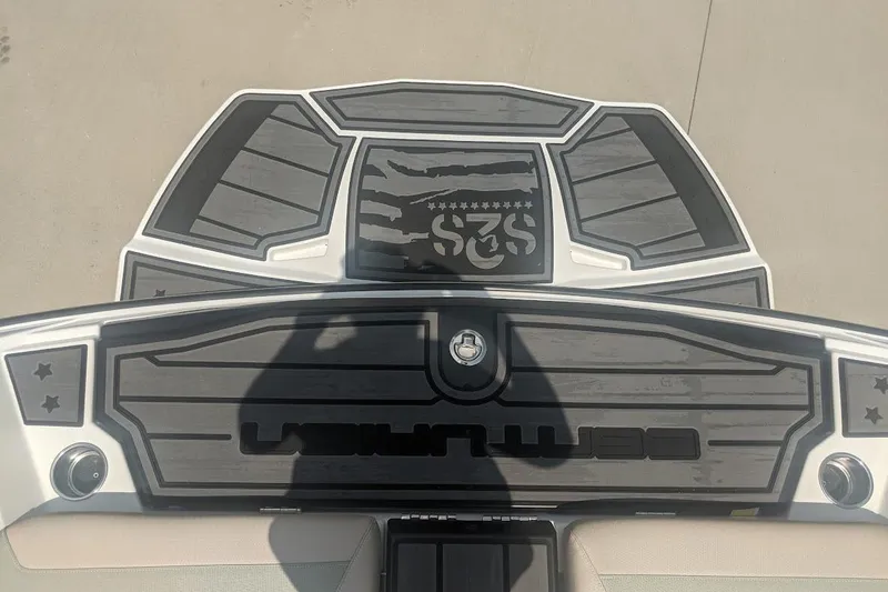 Slide: The Image of 2022 Centurion Ri245 boat deck with custom black and gray design. - 4