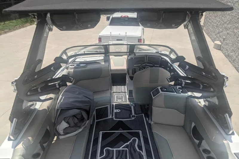 Slide: The Image of 2022 Centurion Ri245 boat interior with modern seating and sleek design. - 5