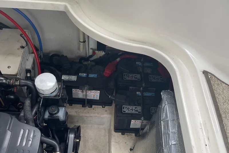 Slide: The Image of Engine compartment of a 2007 Sea Ray 290 Sundancer with visible batteries and components. - 20