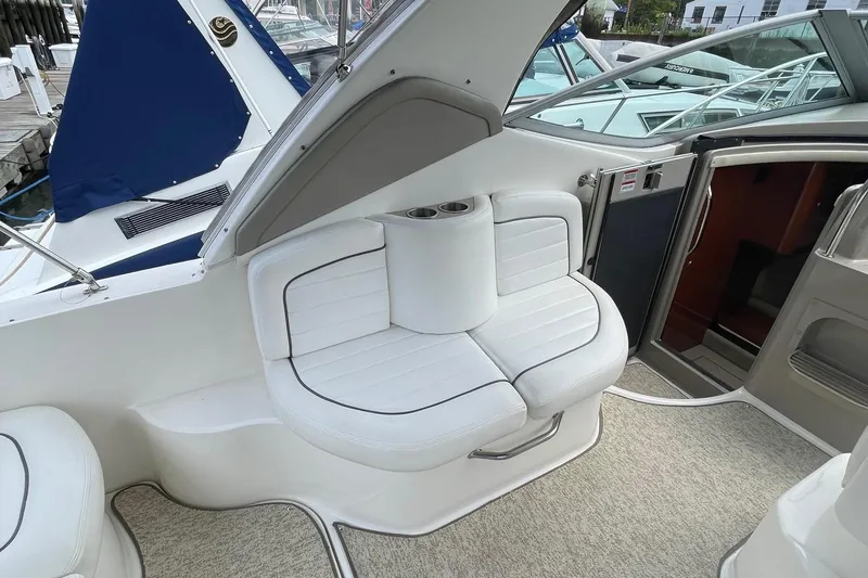 Slide: The Image of 2007 Sea Ray 290 Sundancer interior with white seating and cup holders. - 6