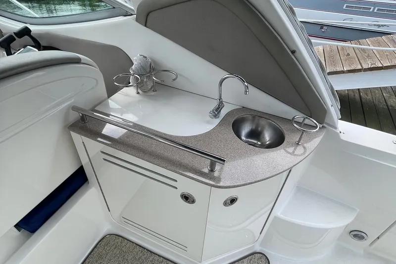 Slide: The Image of 2007 Sea Ray 290 Sundancer boat interior with sink and countertop. - 7