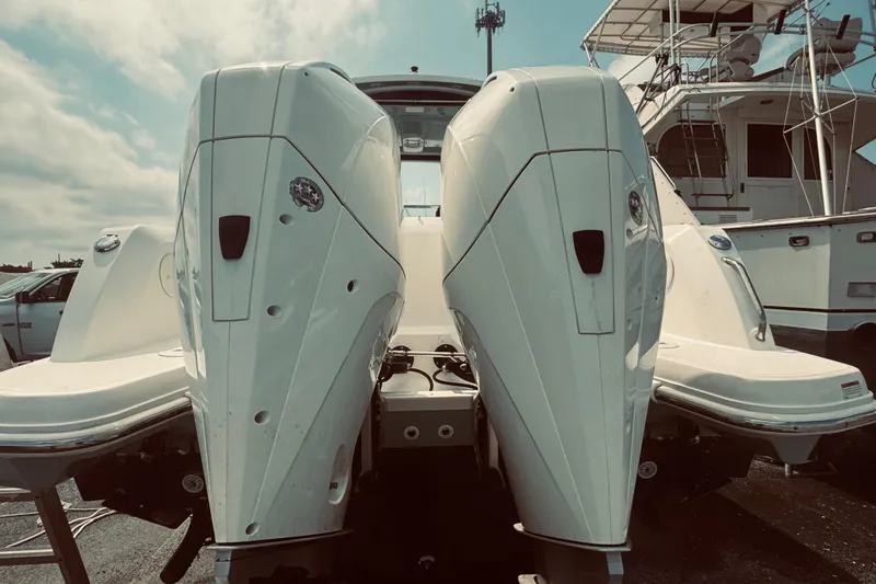 Slide: The Image of 2020 Boston Whaler 270 Vantage with dual outboard engines, docked at marina. - 11