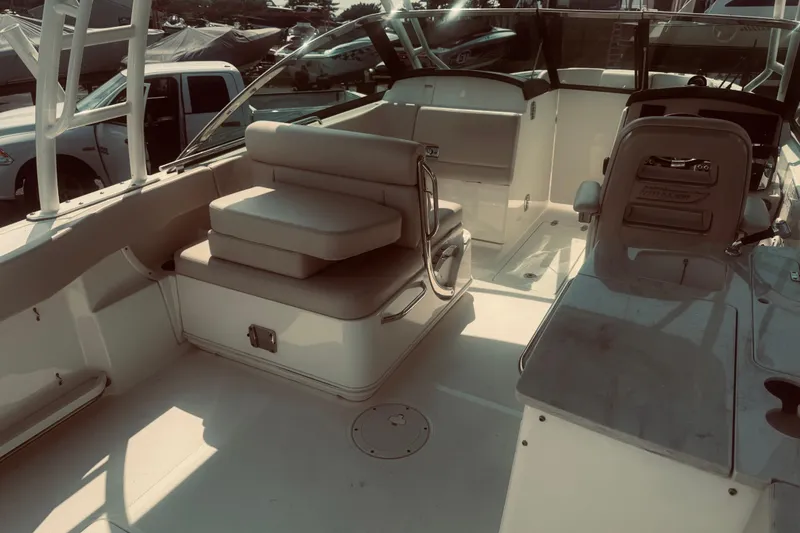 Slide: The Image of 2020 Boston Whaler 270 Vantage boat interior with seating and helm station. - 17