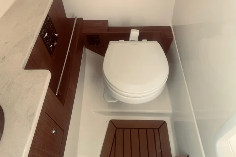 Slide: The Image of 2020 Boston Whaler 270 Vantage boat interior with modern marine toilet. - 22