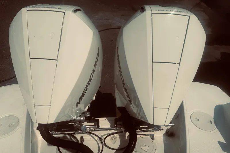 Slide: The Image of Twin Mercury outboard engines on a 2020 Boston Whaler 270 Vantage boat. - 8