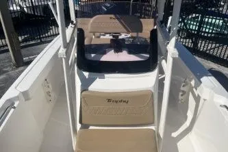 Slide: The Image of 2022 Trophy T22 boat interior with beige seating and steering console. - 7