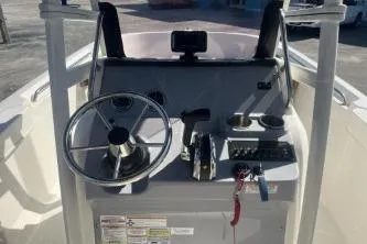 Slide: The Image of 2022 Trophy T22 boat dashboard with steering wheel and controls. - 9