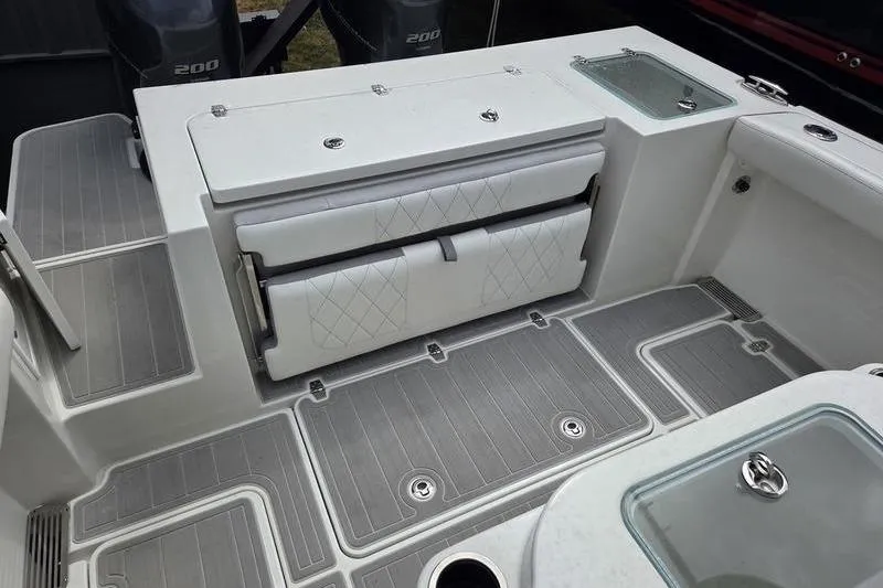 Slide: The Image of 2023 Parker 2600 Center Console boat interior with foldable seating and storage. - 11