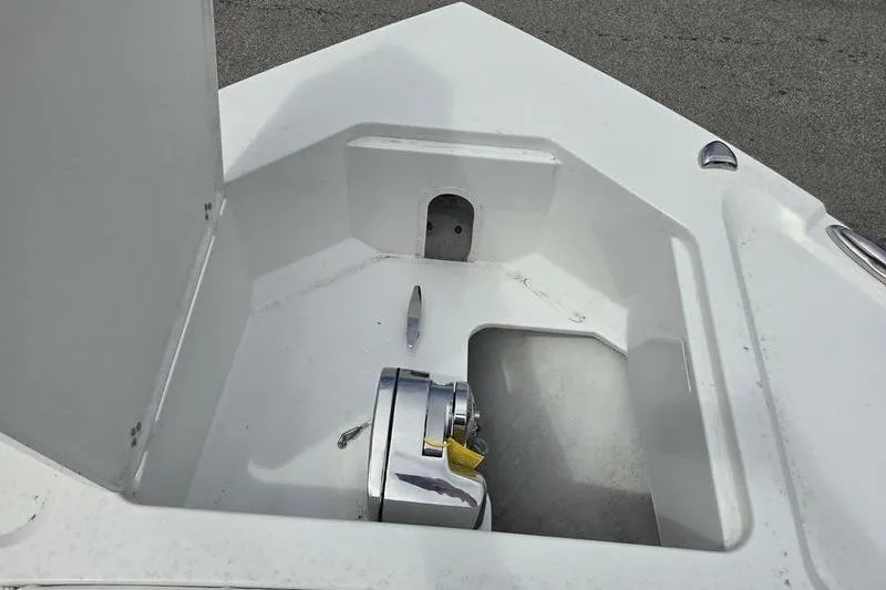 Slide: The Image of 2023 Parker 2600 Center Console boat anchor compartment with winch. - 13