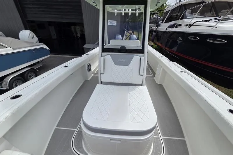 Slide: The Image of 2023 Parker 2600 Center Console boat interior with seating and console view. - 14