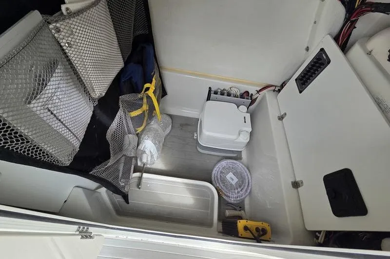 Slide: The Image of Interior of 2023 Parker 2600 Center Console boat with storage and equipment. - 3