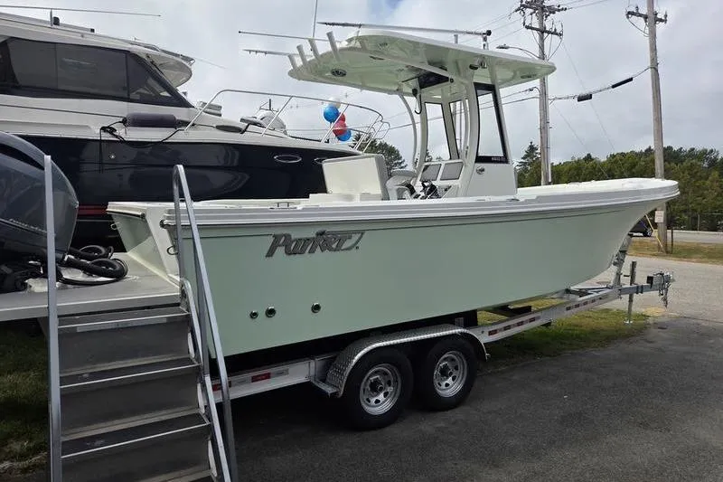 Slide: The Image of 2023 Parker 2600 Center Console boat on trailer, displayed outdoors. - 4