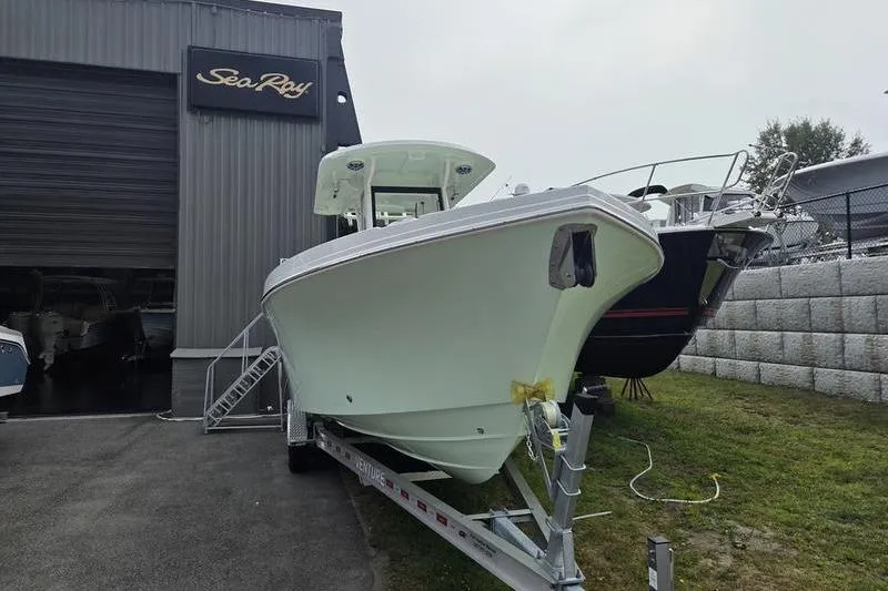 Slide: The Image of 2023 Parker 2600 Center Console boat on trailer outside Sea Ray dealership. - 5