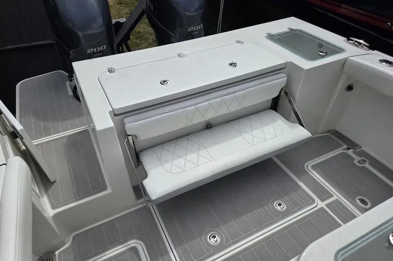 Slide: The Image of 2023 Parker 2600 Center Console boat with foldable seating and dual engines. - 9