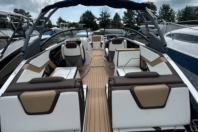 Slide: The Image of 2021 Yamaha Boats 252S interior with luxurious seating and sleek design. - 6
