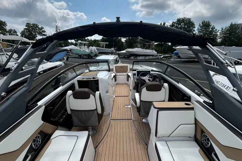 Slide: The Image of 2021 Yamaha Boats 252S interior with sleek seating and modern design. - 7