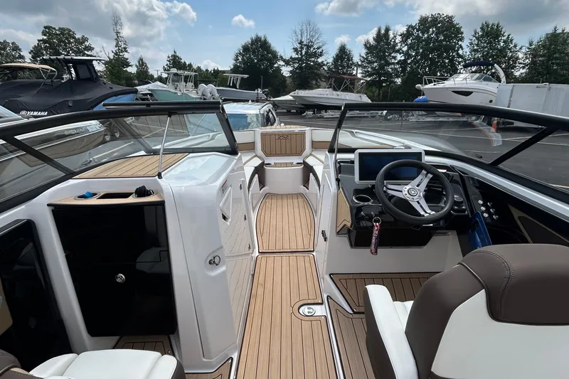 Slide: The Image of 2021 Yamaha Boats 252S interior with sleek design, modern dashboard, and comfortable seating. - 8