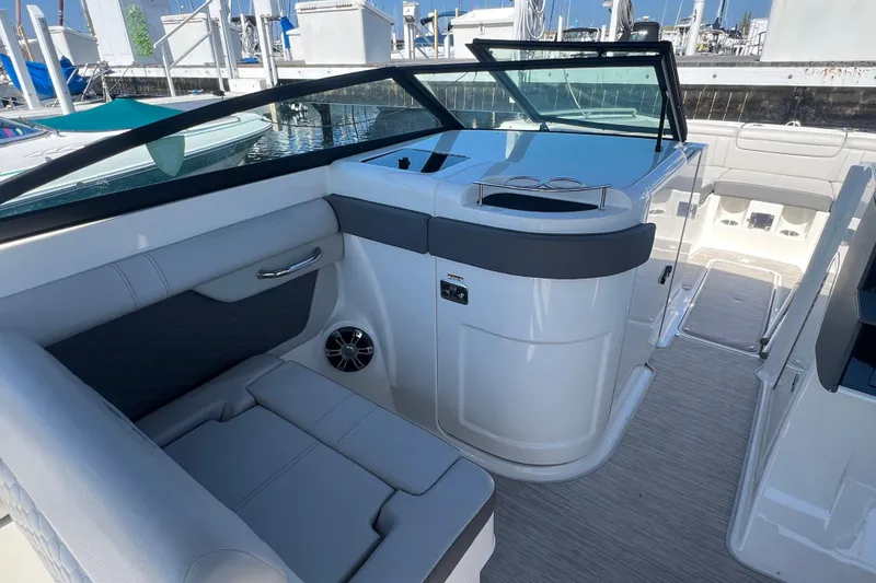 Slide: The Image of 2021 Sea Ray SDX 290 boat interior with sleek seating and modern design. - 10