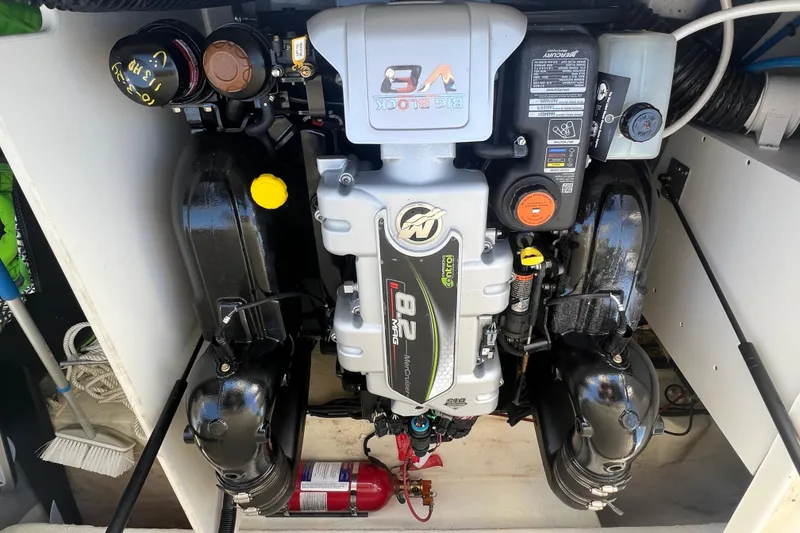 Slide: The Image of Engine compartment of a 2021 Sea Ray SDX 290 boat, featuring a powerful V8 engine. - 15