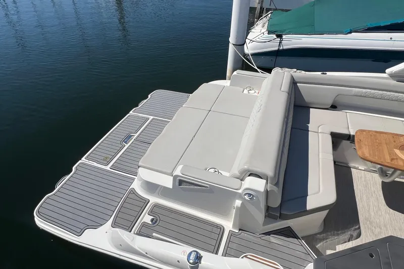Slide: The Image of 2021 Sea Ray SDX 290 boat with spacious seating and swim platform. - 7