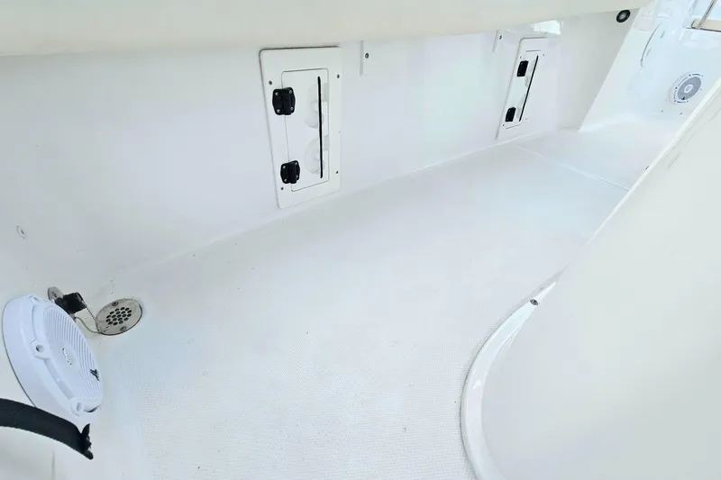 Slide: The Image of 2023 Sea Hunt BX 25 FS boat interior with storage compartments and speaker. - 22