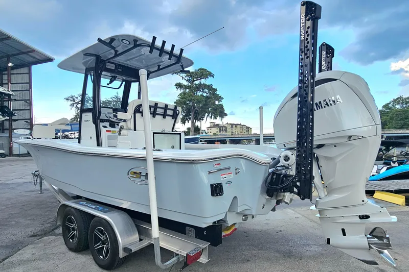 Slide: The Image of 2023 Sea Hunt BX 25 FS boat with Yamaha engine on a trailer. - 3