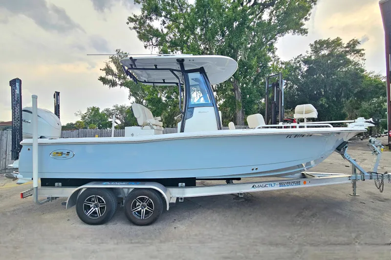 Slide: The Image of 2023 Sea Hunt BX 25 FS boat on trailer, parked outdoors. - 7