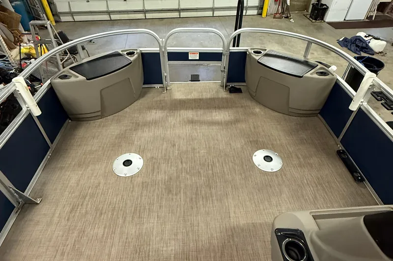 Slide: The Image of 2023 Sun Tracker Bass Buggy 18 DLX pontoon boat interior with spacious deck layout. - 11