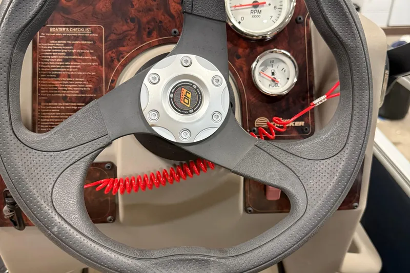 Slide: The Image of Steering wheel and dashboard of 2023 Sun Tracker Bass Buggy 18 DLX boat. - 13