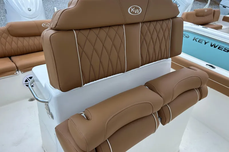 Slide: The Image of 2026 Key West 239 FS boat with luxurious tan leather seating and elegant design. - 12