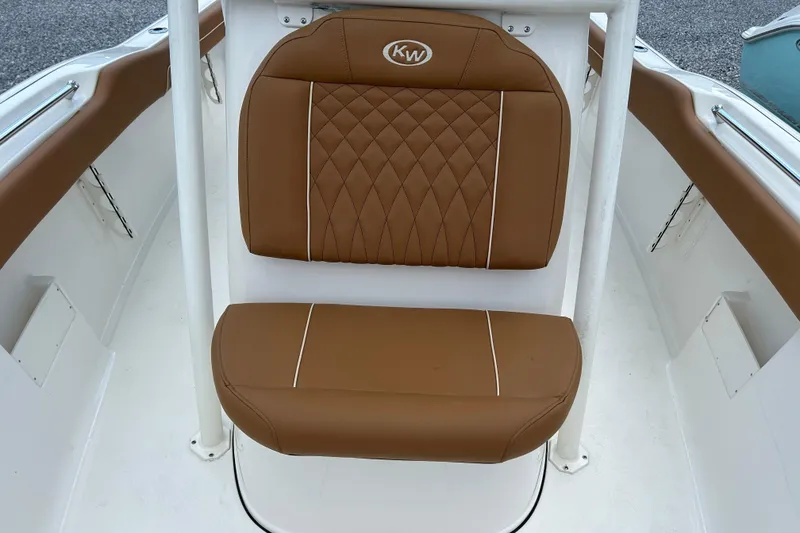 Slide: The Image of Brown cushioned seat on 2026 Key West 239 FS boat, featuring diamond stitching. - 14
