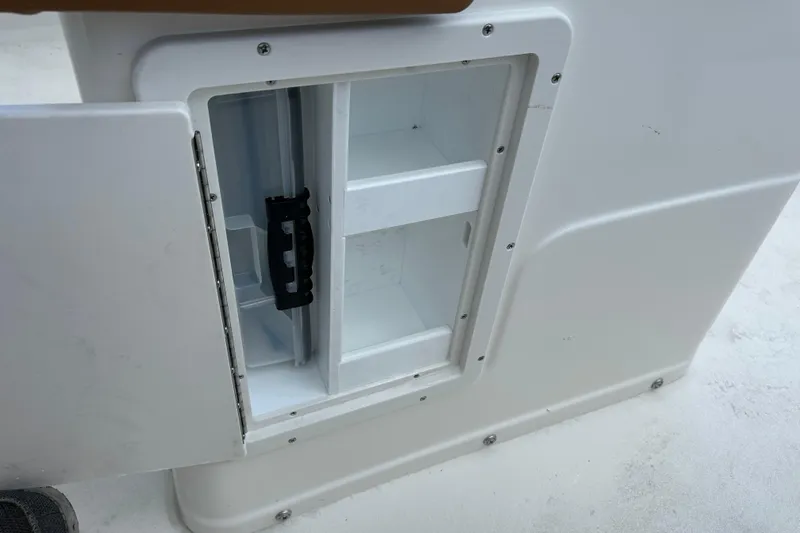 Slide: The Image of Open storage compartment on a 2026 Key West 239 FS boat. - 17