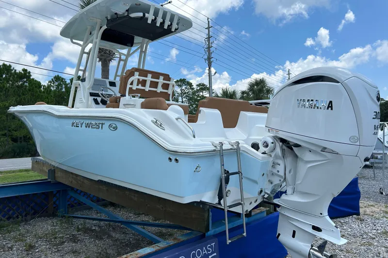 Slide: The Image of 2026 Key West 239 FS boat with Yamaha engine on display outdoors. - 5