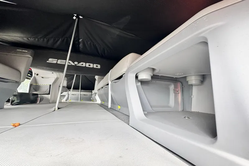 Slide: The Image of 2023 Sea-Doo Switch Cruise 21 interior storage and seating area. - 10
