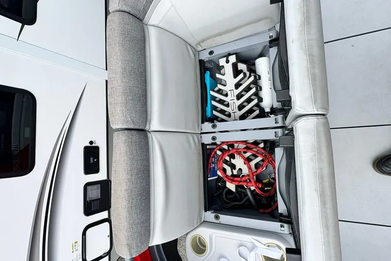 Slide: The Image of Storage compartment of 2023 Sea-Doo Switch Cruise 21, featuring organized boating accessories. - 13