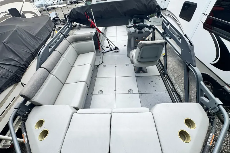 Slide: The Image of 2023 Sea-Doo Switch Cruise 21 interior with spacious seating and modern controls. - 18