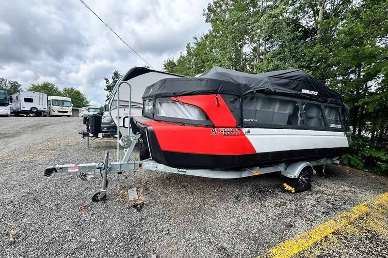 Slide: The Image of 2023 Sea-Doo Switch Cruise 21 boat on trailer, covered, parked outdoors. - 3