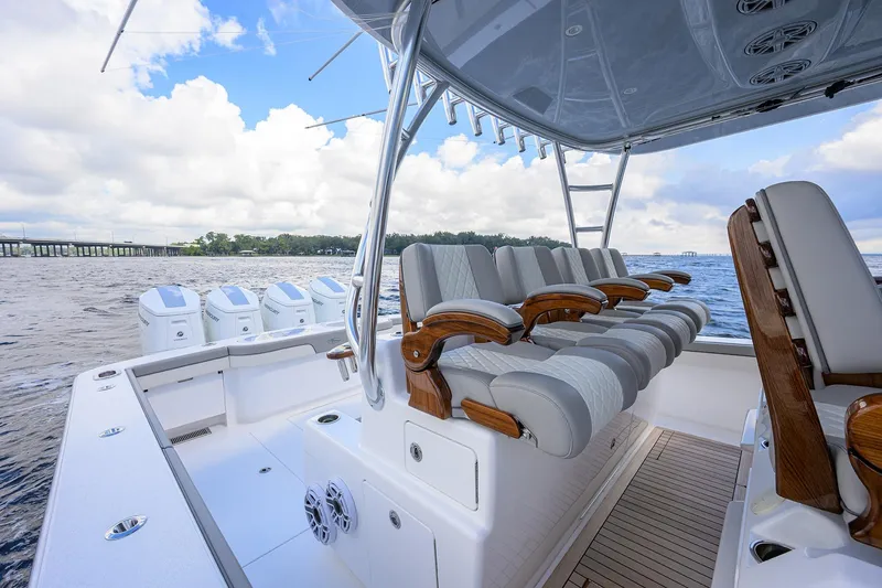 Slide: The Image of Luxury Valhalla V-46 boat interior, 2026 model, featuring plush seating and multiple outboard engines. - 21