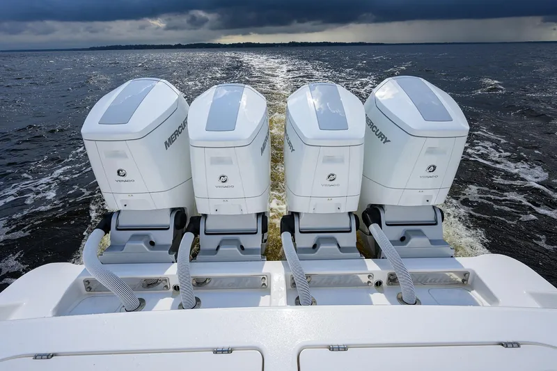 Slide: The Image of Four Mercury Verado outboard engines on a 2026 Valhalla V-46 boat, cruising on open water. - 38