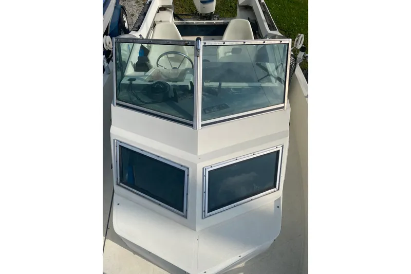 Slide: The Image of 1984 Hydra-Sports 2250 WA boat cockpit with windshield and steering wheel. - 10