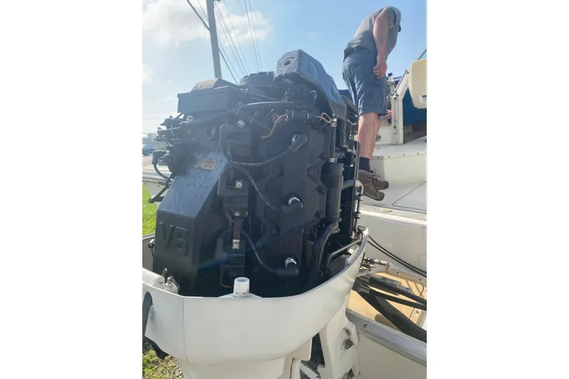 Slide: The Image of 1984 Hydra-Sports 2250 WA boat with V6 engine, person standing on deck. - 16