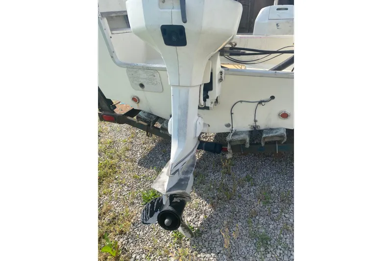 Slide: The Image of 1984 Hydra-Sports 2250 WA boat with outboard motor on gravel surface. - 18