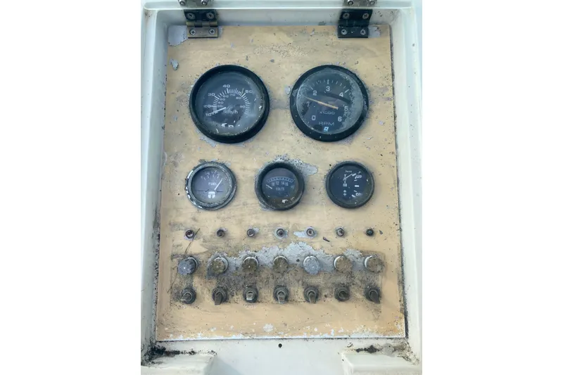 Slide: The Image of Dashboard of a 1984 Hydra-Sports 2250 WA boat with gauges and switches. - 19