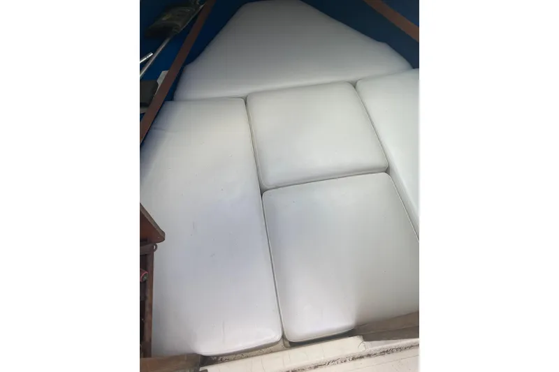 Slide: The Image of 1984 Hydra-Sports 2250 WA boat interior with white cushioned seating. - 5